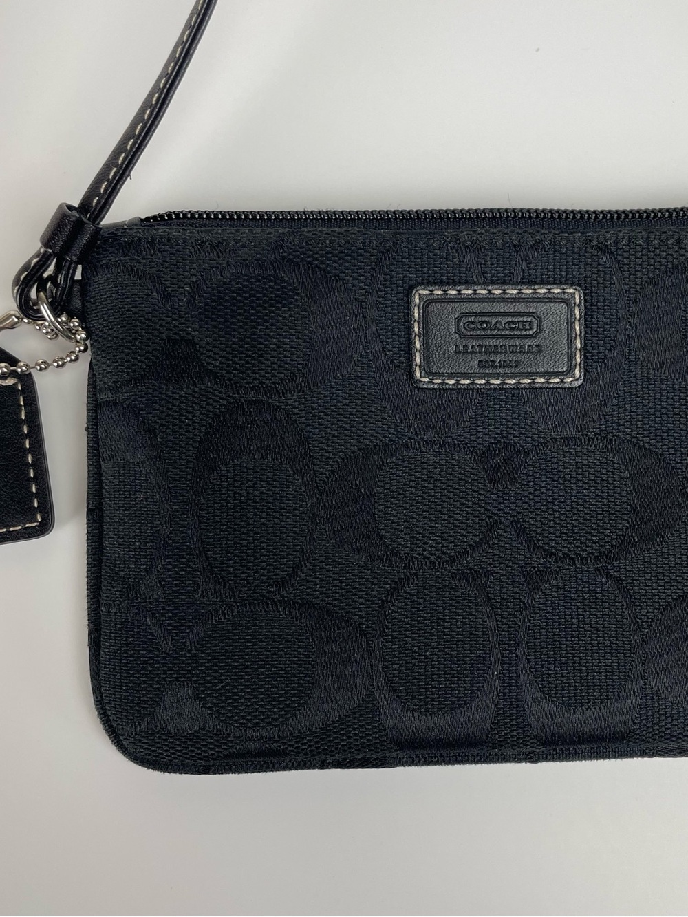 NWOT Vintage Y2K Coach black wristlet with repeating circular C logo pattern